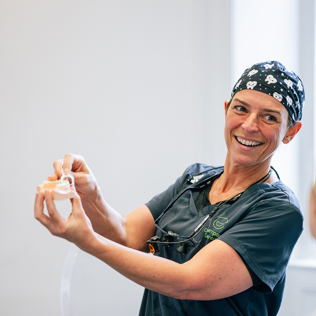 Happy patient looking in a mirror